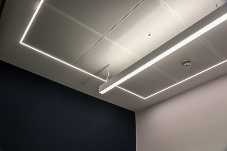 Bespoke fitted lighting in an enclosed office space for Gartner. Installed by Michael J Lonsdale.