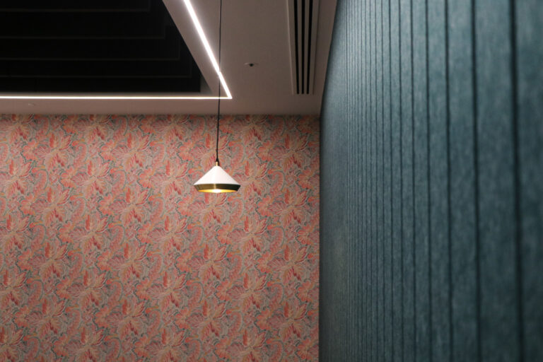 Bespoke light fittings on patterned wallpaper at Gartner office. Installed by Michael J Lonsdale